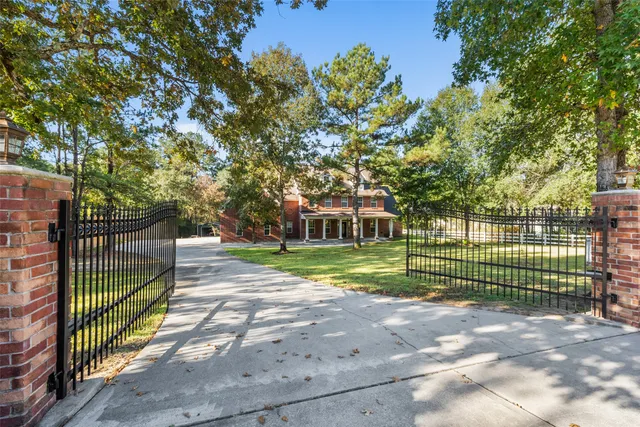 an entryway space with chandelier fan and windows