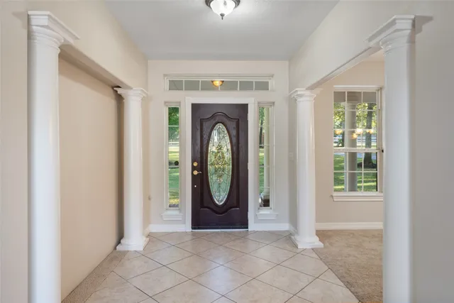 a view of a livingroom with an empty space and a fireplace