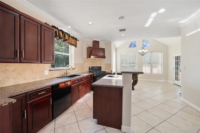 an empty room with windows and fireplace