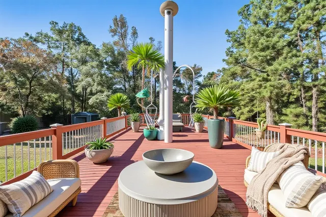 an empty room with windows and fireplace