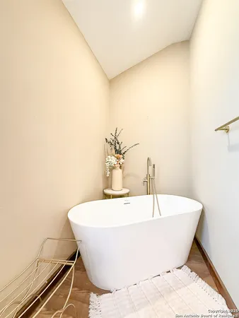 a white bath tub sitting in a bathroom