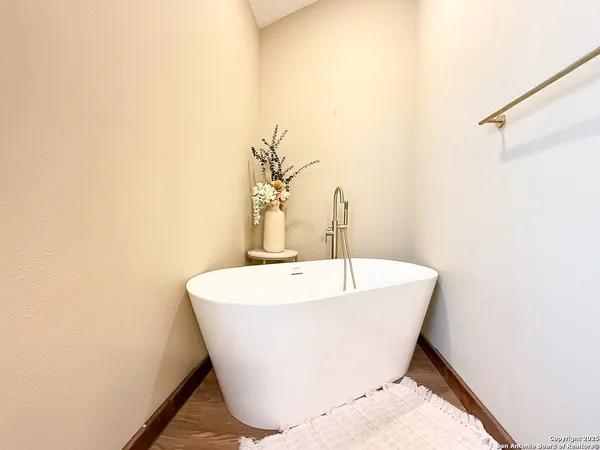a white bath tub sitting in a bathroom
