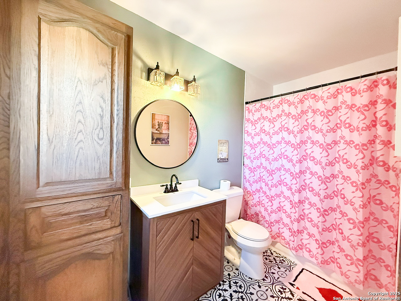 200 Pr 6631 Devine, TX 78016 - Photo 23 of 41 a bathroom with a sink toilet mirror vanity and shower