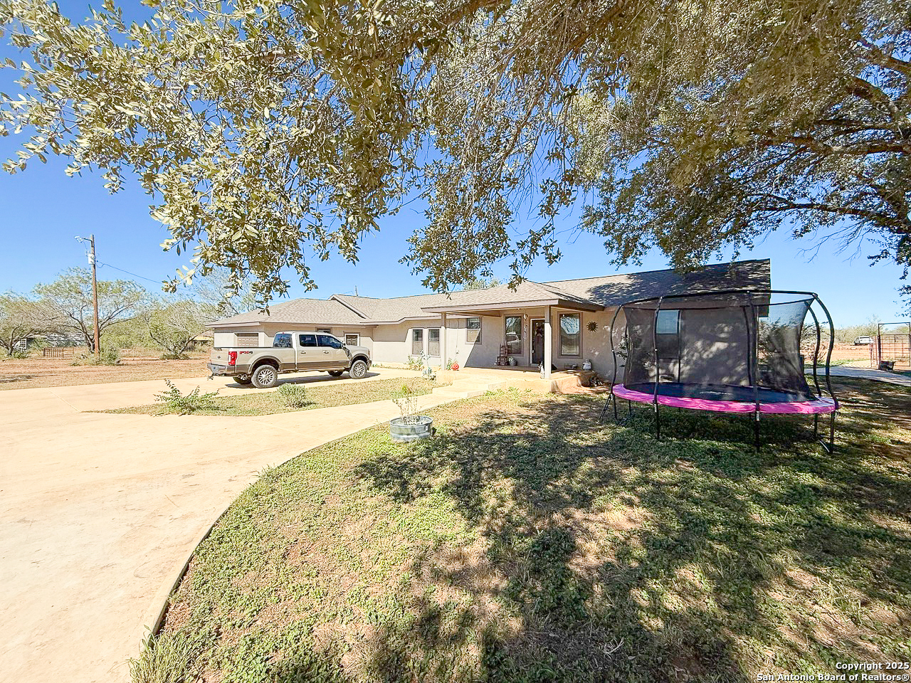200 Pr 6631 Devine, TX 78016 - Photo 40 of 41 a front view of house with yard and trees