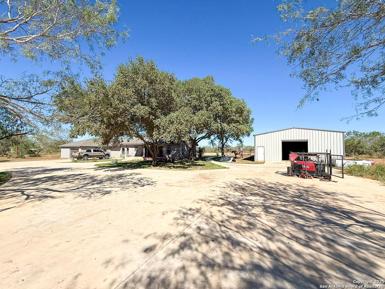 200 Pr 6631 Devine, TX 78016 - Photo 41 of 41 a view of a yard with a tree