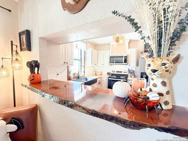 a large living room with furniture and a fireplace