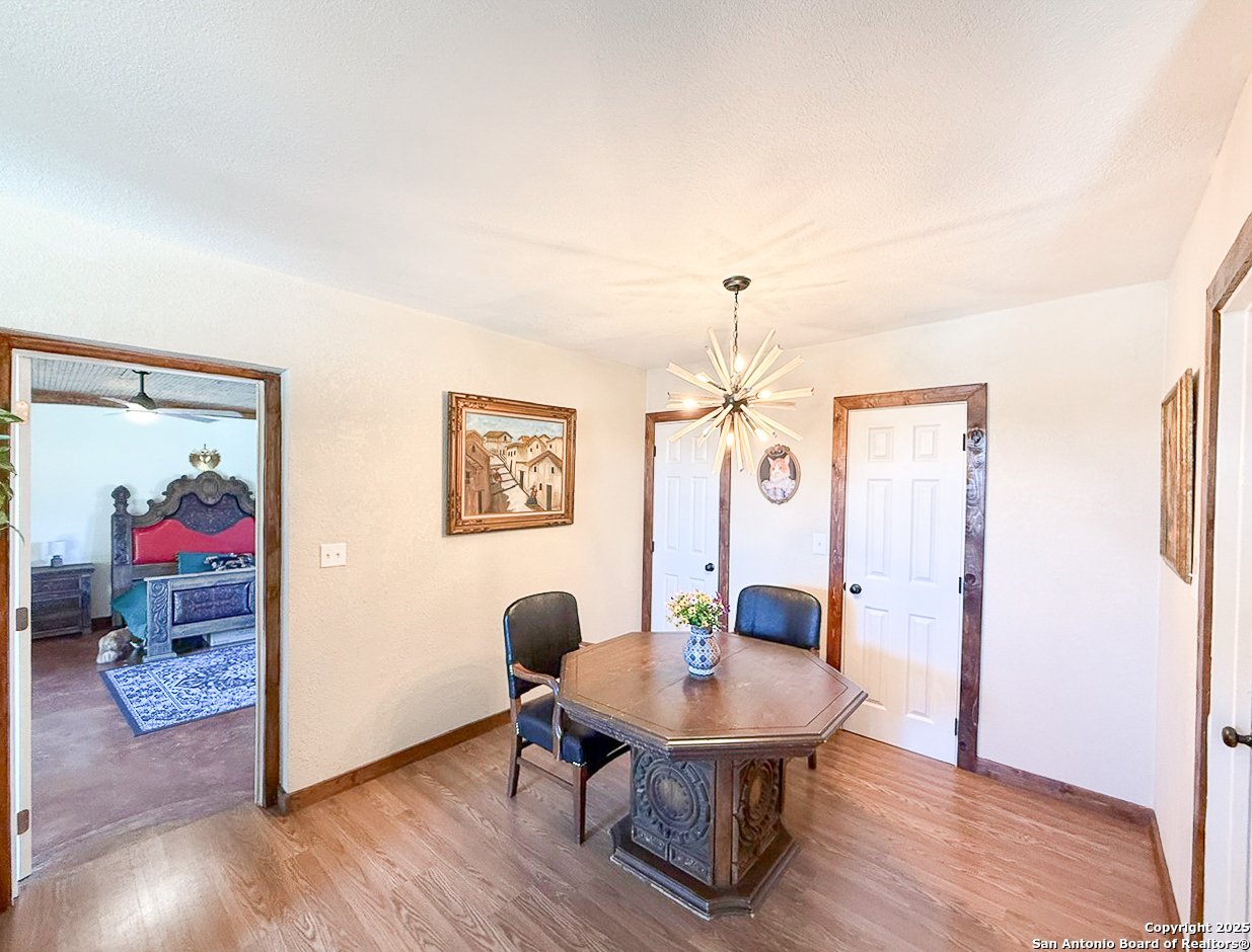 200 Pr 6631 Devine, TX 78016 - Photo 10 of 41 a view of a dining room with furniture and wooden floor