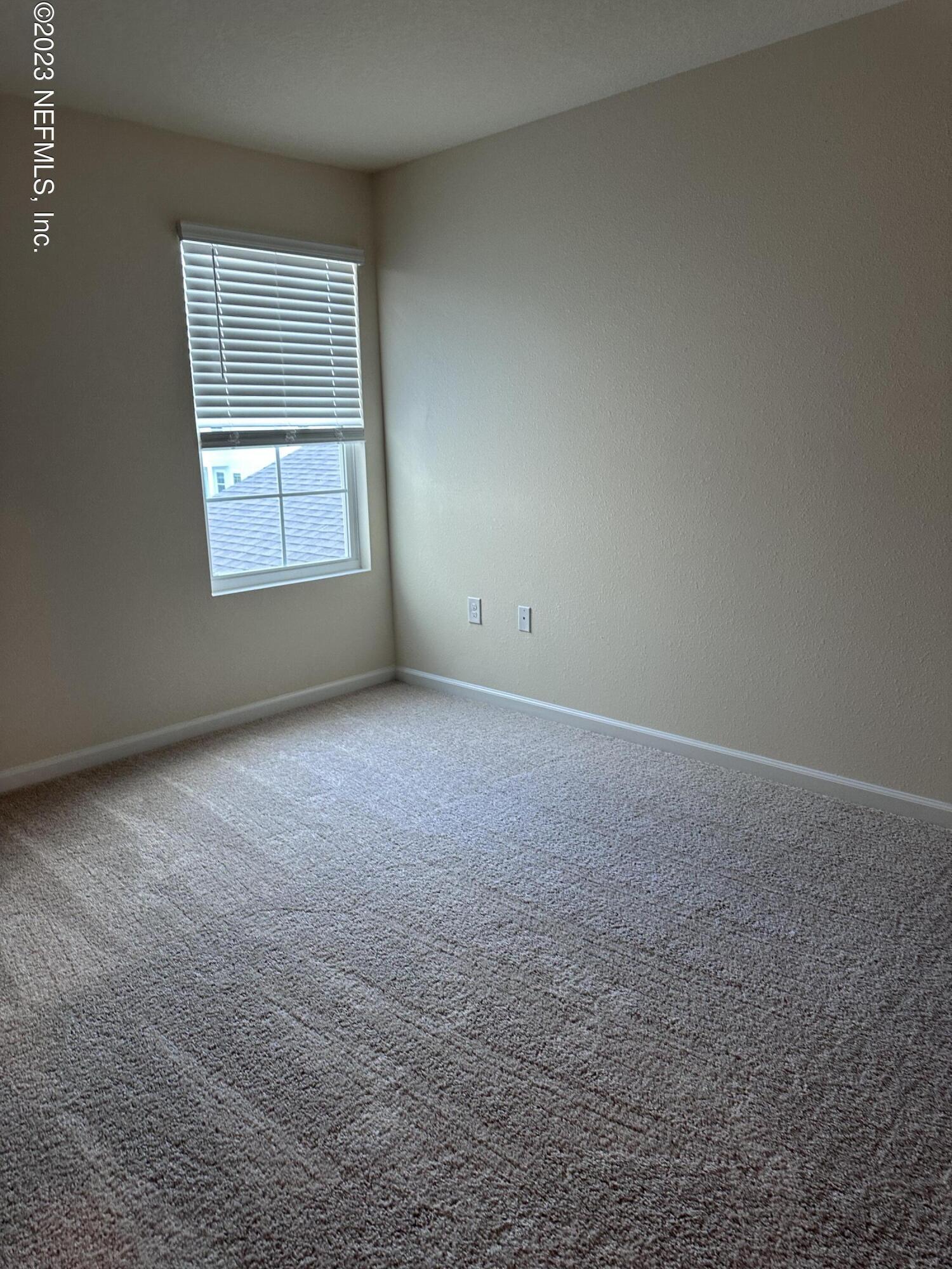 90 Tidal Bch Avenue St. Augustine, FL 32095 - Photo 7 of 7 an empty room with windows