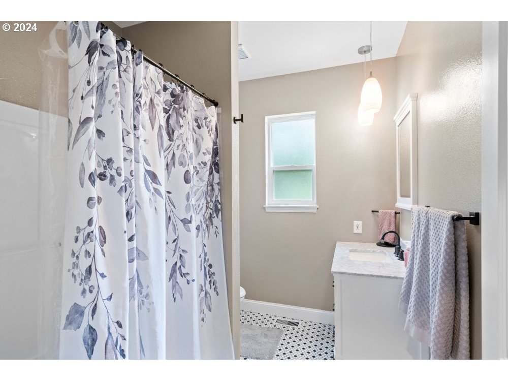 6034 Treehouse Road Monmouth, OR 97361 - Photo 17 of 45 a bathroom with a sink and a mirror