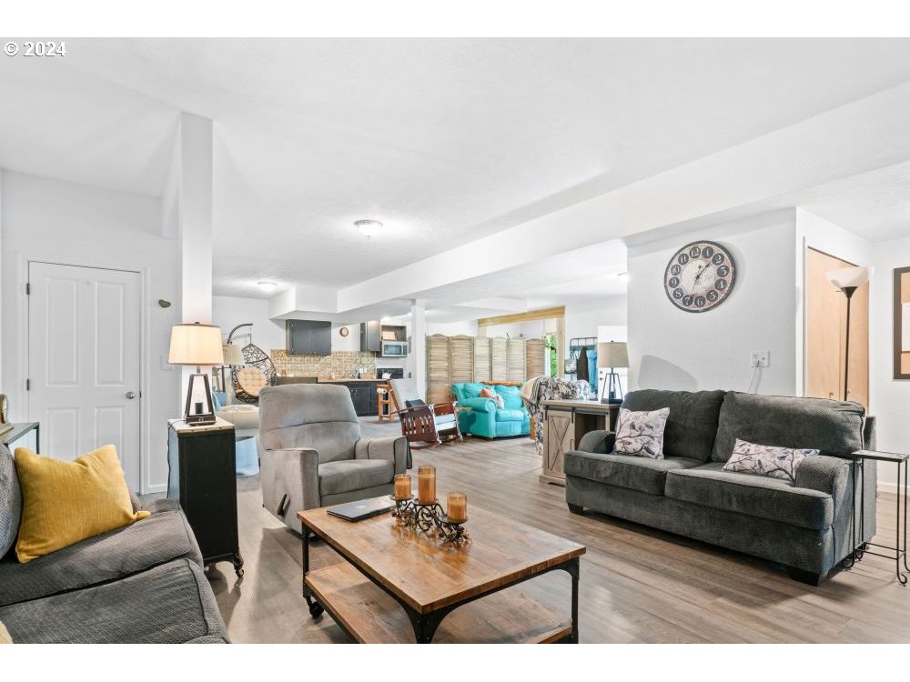 6034 Treehouse Road Monmouth, OR 97361 - Photo 27 of 45 a living room with furniture and a table
