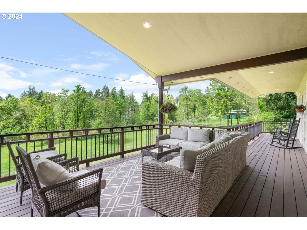 6034 Treehouse Road Monmouth, OR 97361 - Photo 33 of 45 a balcony with furniture and wooden floor