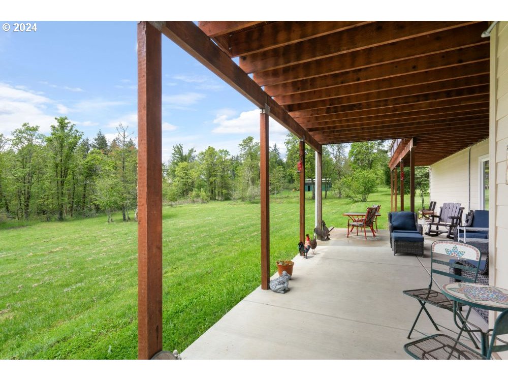 6034 Treehouse Road Monmouth, OR 97361 - Photo 34 of 45 a patio with yard table and chairs