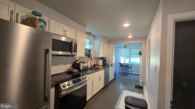 a view of a storage and utility room with racks on the wall