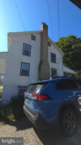 a view of a dining room with furniture and window