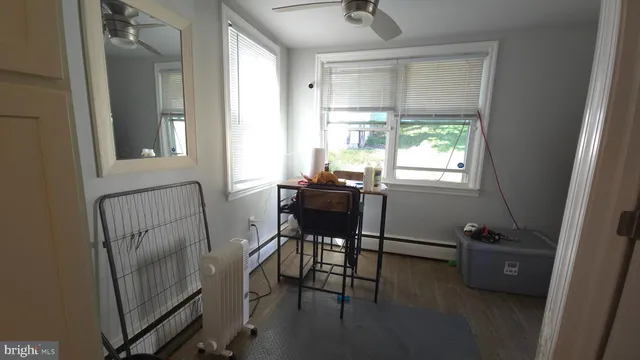 a bathroom with a sink toilet and mirror