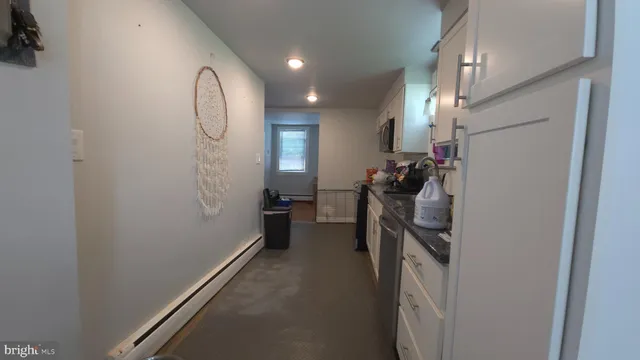 a view of a room with gym equipment and windows