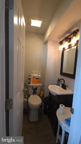 a room with a mirror and a sink