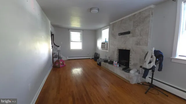 a spacious bedroom with a bed and a window