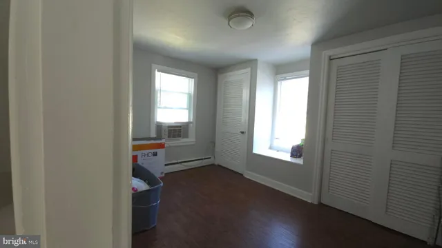 a room with chair and a mirror