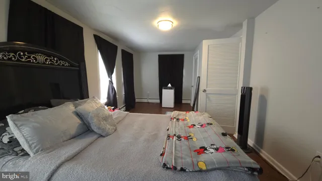 a bathroom with a sink mirror vanity and toilet