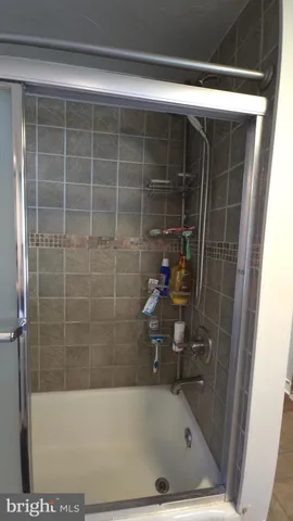 a living room with a couch and a window