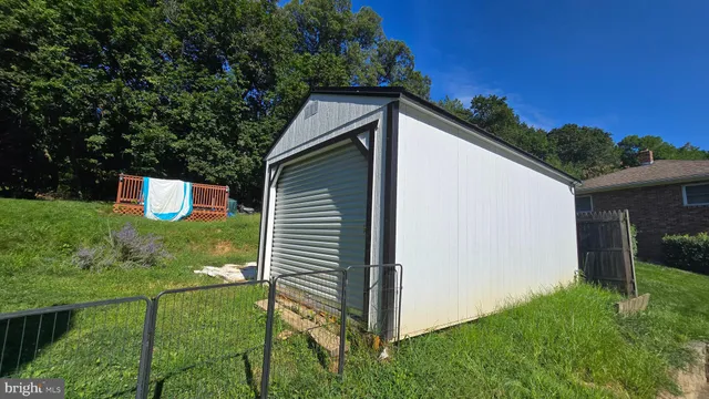 a view of a backyard with large trees