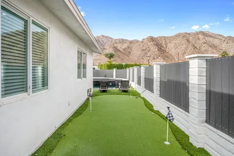a view of a patio with a backyard