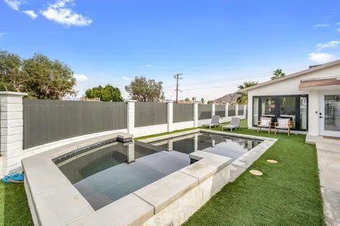 a view of a house with swimming pool