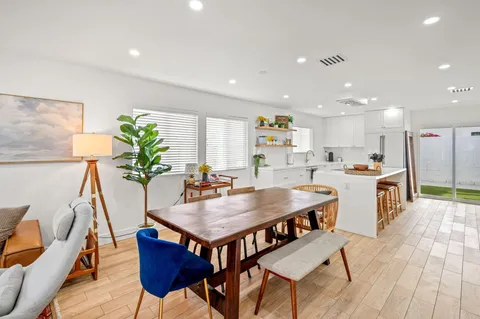 a kitchen with a table and chairs in it