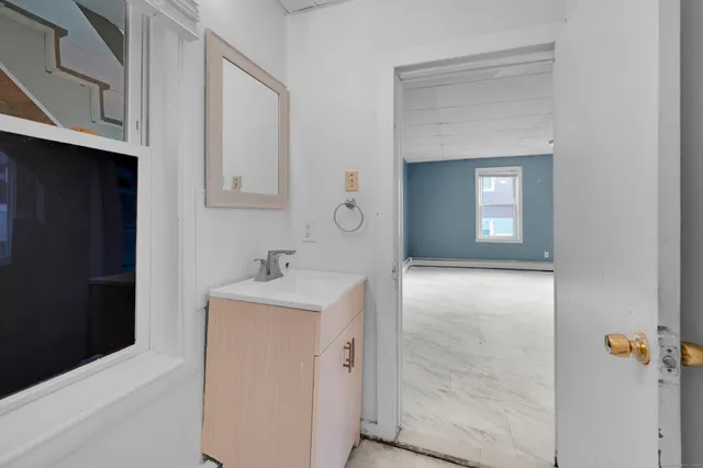 a bathroom with a sink and a mirror