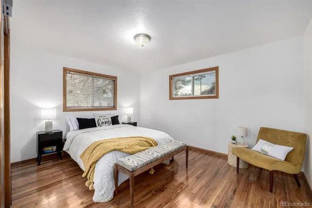 a bedroom with a bed and a chair