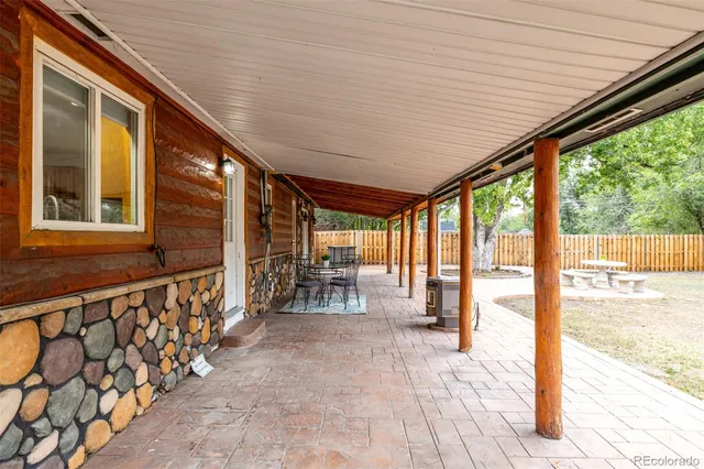 a front view of a house with outdoor seating