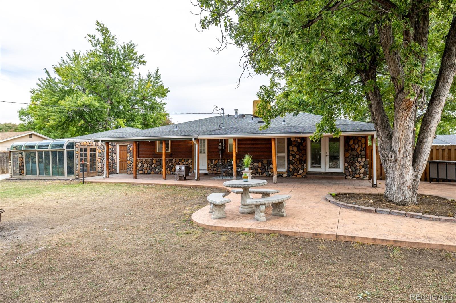 10095 West 41st Avenue Wheat Ridge, CO 80033 - Photo 27 of 37 a front view of a house with swimming pool and porch