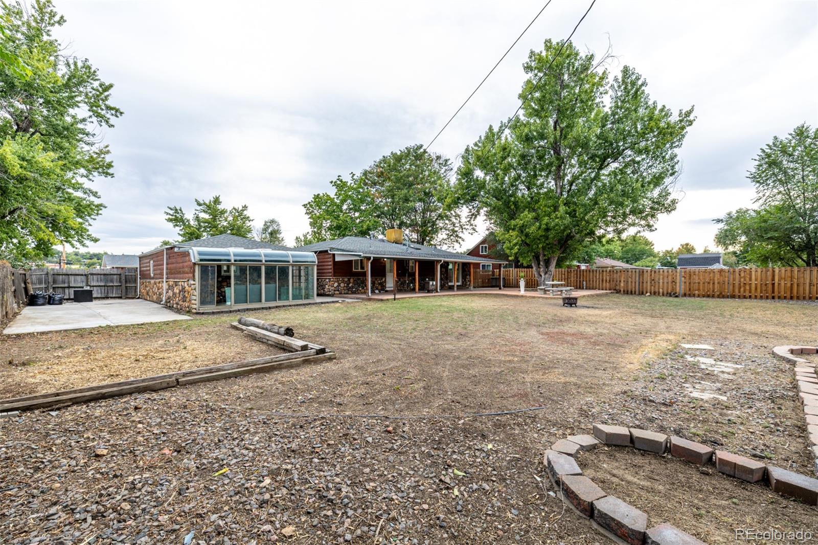 10095 West 41st Avenue Wheat Ridge, CO 80033 - Photo 29 of 37 a view of a house with a yard