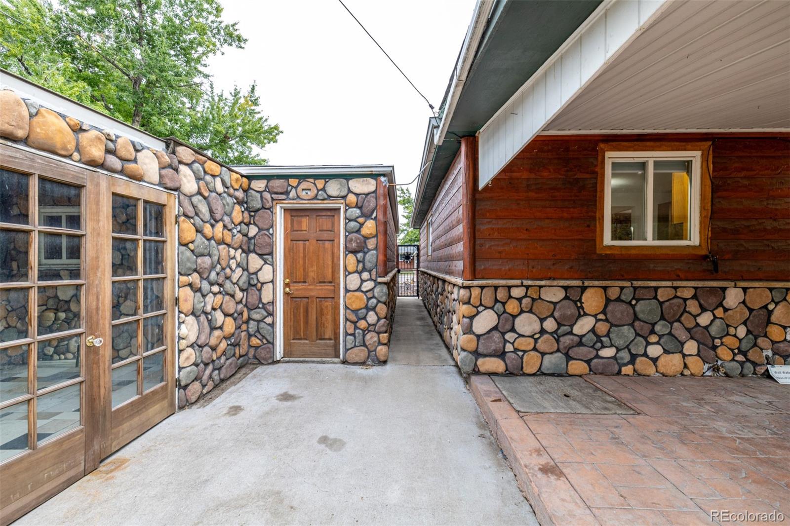 10095 West 41st Avenue Wheat Ridge, CO 80033 - Photo 31 of 37 a view of a pathway along the house