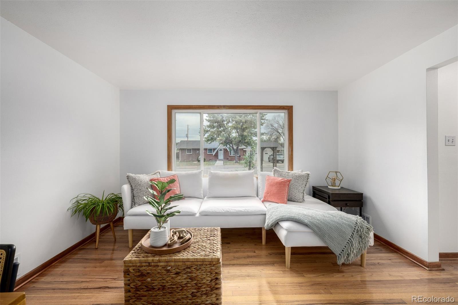 10095 West 41st Avenue Wheat Ridge, CO 80033 - Photo 5 of 37 a living room with furniture and a large window