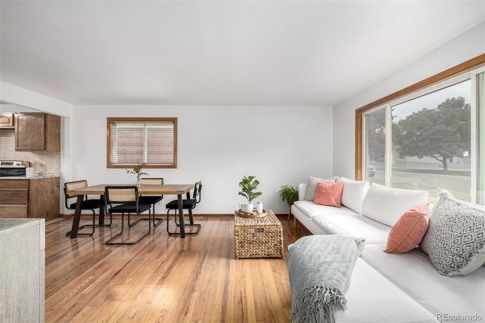 10095 West 41st Avenue Wheat Ridge, CO 80033 - Photo 6 of 37 a living room with furniture and a large window