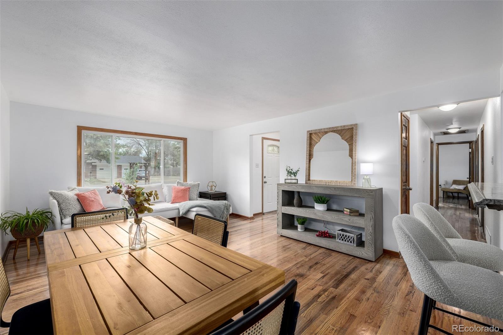 10095 West 41st Avenue Wheat Ridge, CO 80033 - Photo 9 of 37 a living room with furniture and a wooden floor