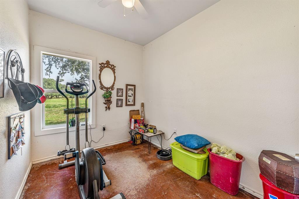 255 Baughman Hill Road Azle, TX 76020 - Photo 13 of 40 a view of a room with gym equipment