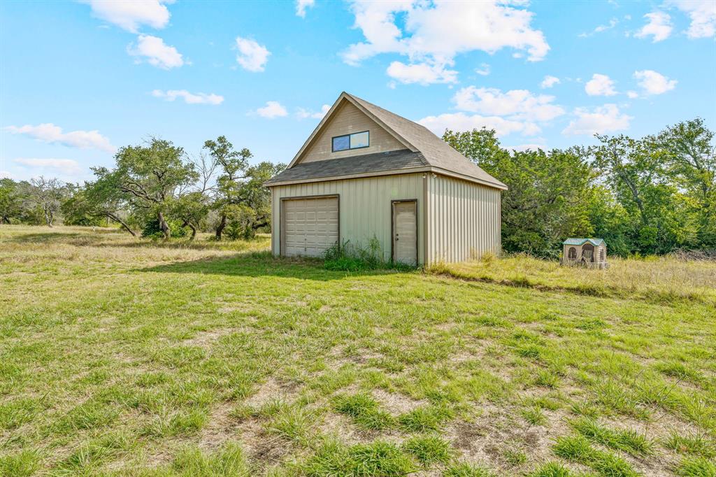 255 Baughman Hill Road Azle, TX 76020 - Photo 20 of 40 a view of an house with backyard space and garden