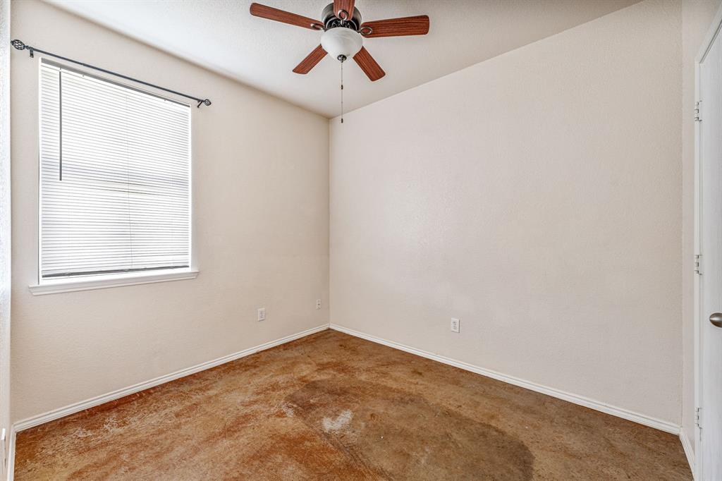 255 Baughman Hill Road Azle, TX 76020 - Photo 22 of 40 an empty room with a window and a ceiling fan