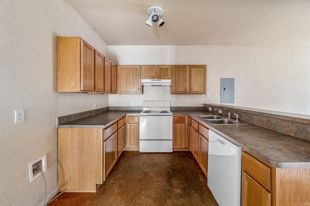 255 Baughman Hill Road Azle, TX 76020 - Photo 26 of 40 a kitchen with a stove and a sink