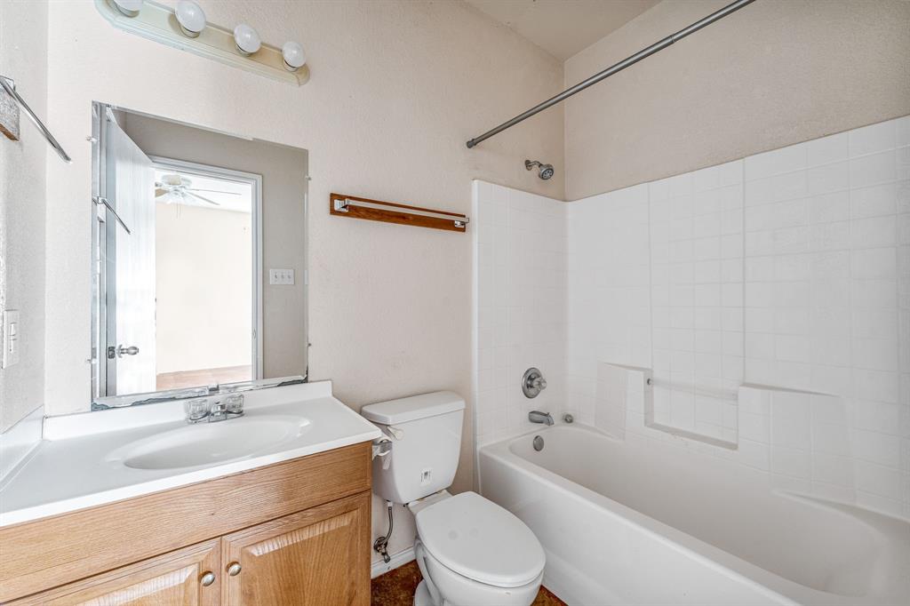 255 Baughman Hill Road Azle, TX 76020 - Photo 27 of 40 a bathroom with a sink a toilet and shower