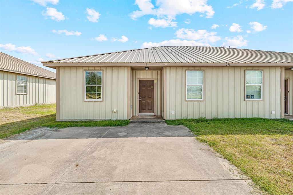 255 Baughman Hill Road Azle, TX 76020 - Photo 28 of 40 a front view of a house with a yard and garage