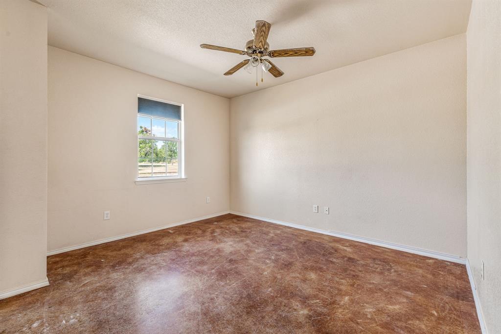 255 Baughman Hill Road Azle, TX 76020 - Photo 30 of 40 an empty room with a window and a fan