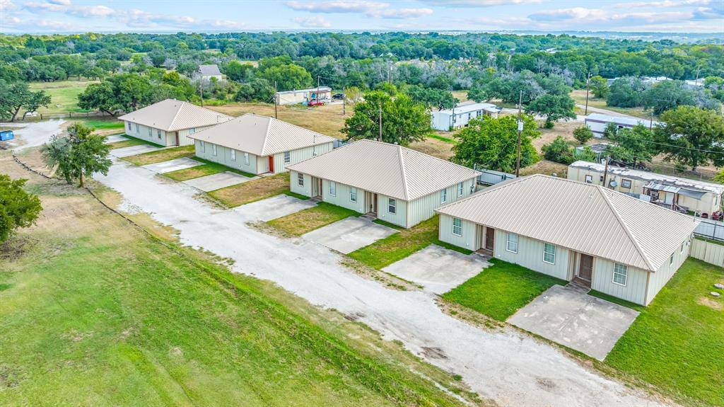255 Baughman Hill Road Azle, TX 76020 - Photo 4 of 40 an aerial view of a house with swimming pool and garden