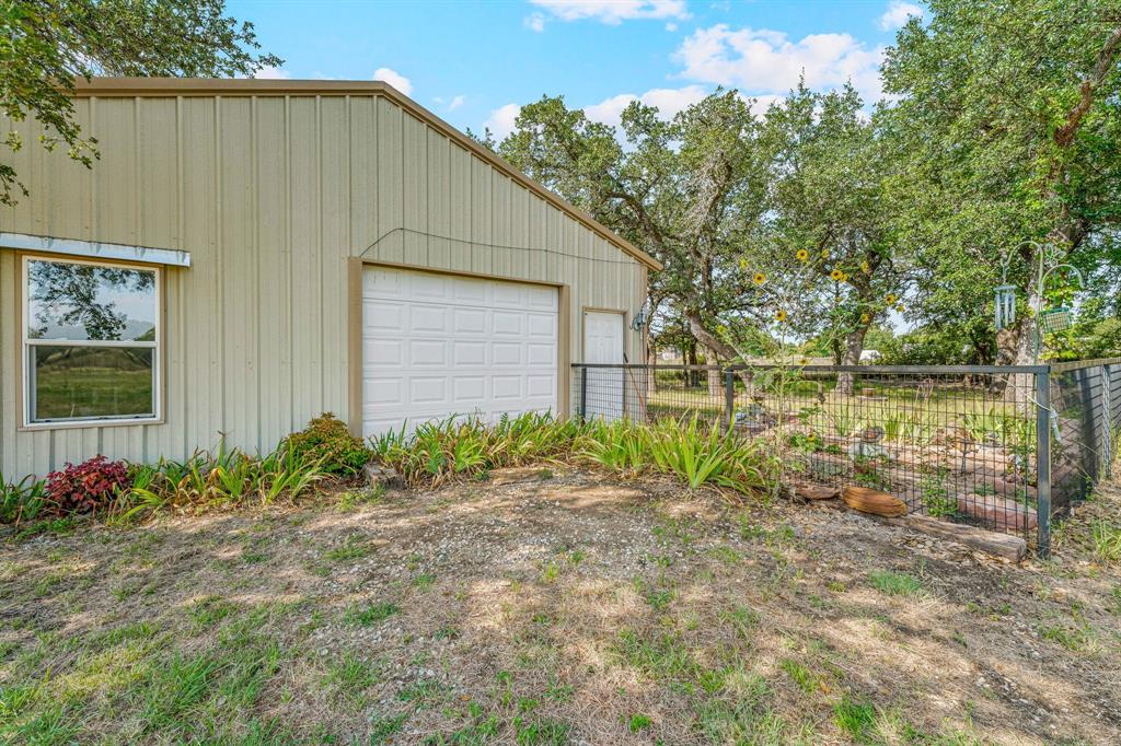 255 Baughman Hill Road Azle, TX 76020 - Photo 8 of 40 a backyard of a house with lots of green space