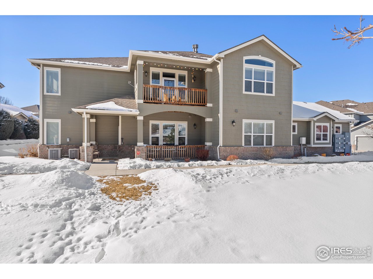 4672 West 20th Road, Unit 723 Greeley, CO 80634 - Photo 1 of 27 a front view of a house with a yard