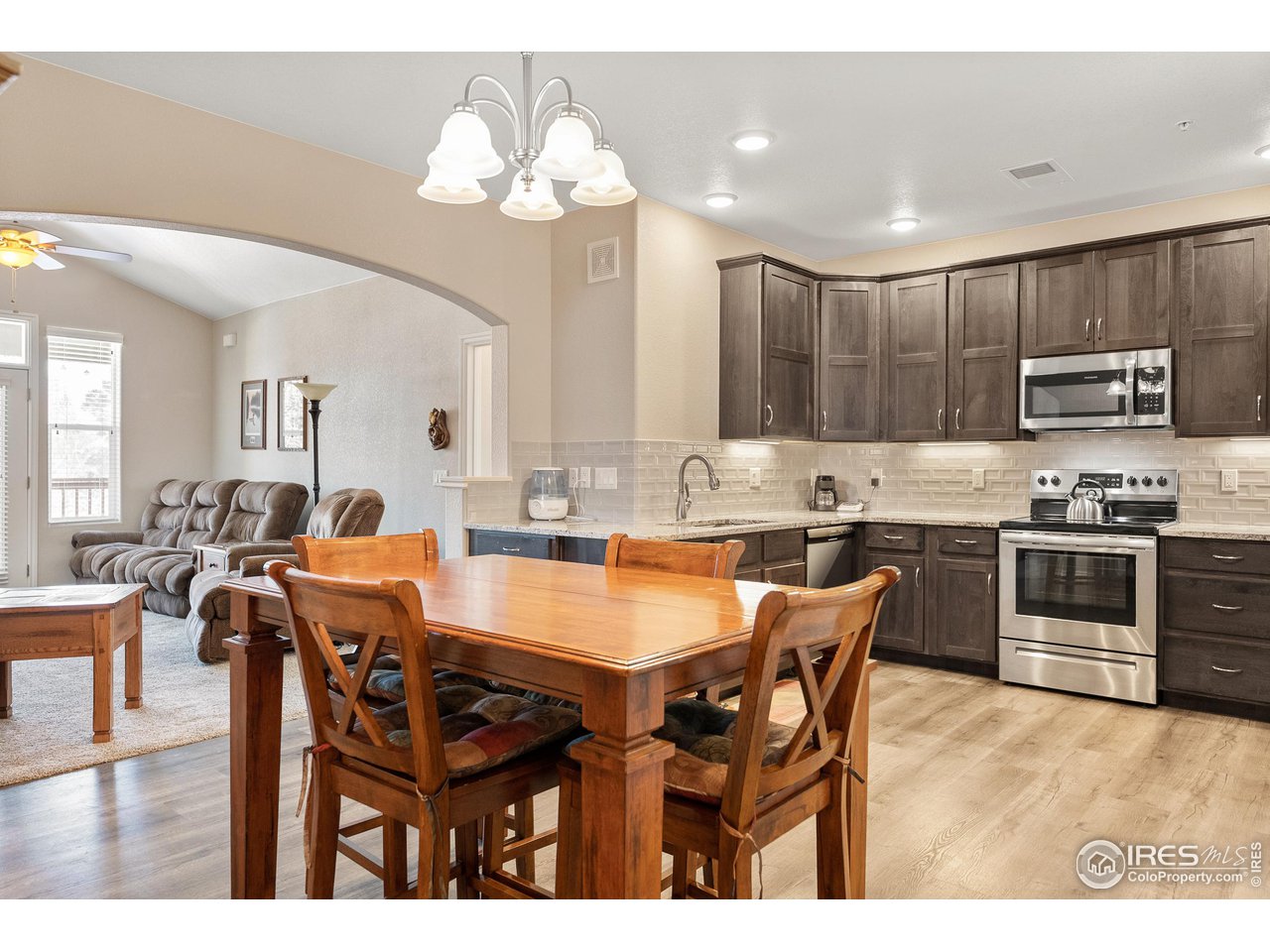 4672 West 20th Road, Unit 723 Greeley, CO 80634 - Photo 12 of 27 a large kitchen with a table and chairs