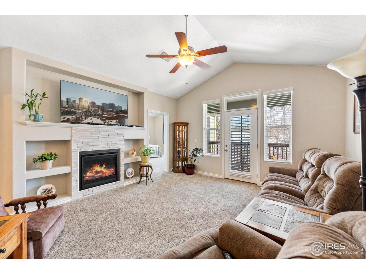 4672 West 20th Road, Unit 723 Greeley, CO 80634 - Photo 13 of 27 a living room with furniture and a fireplace
